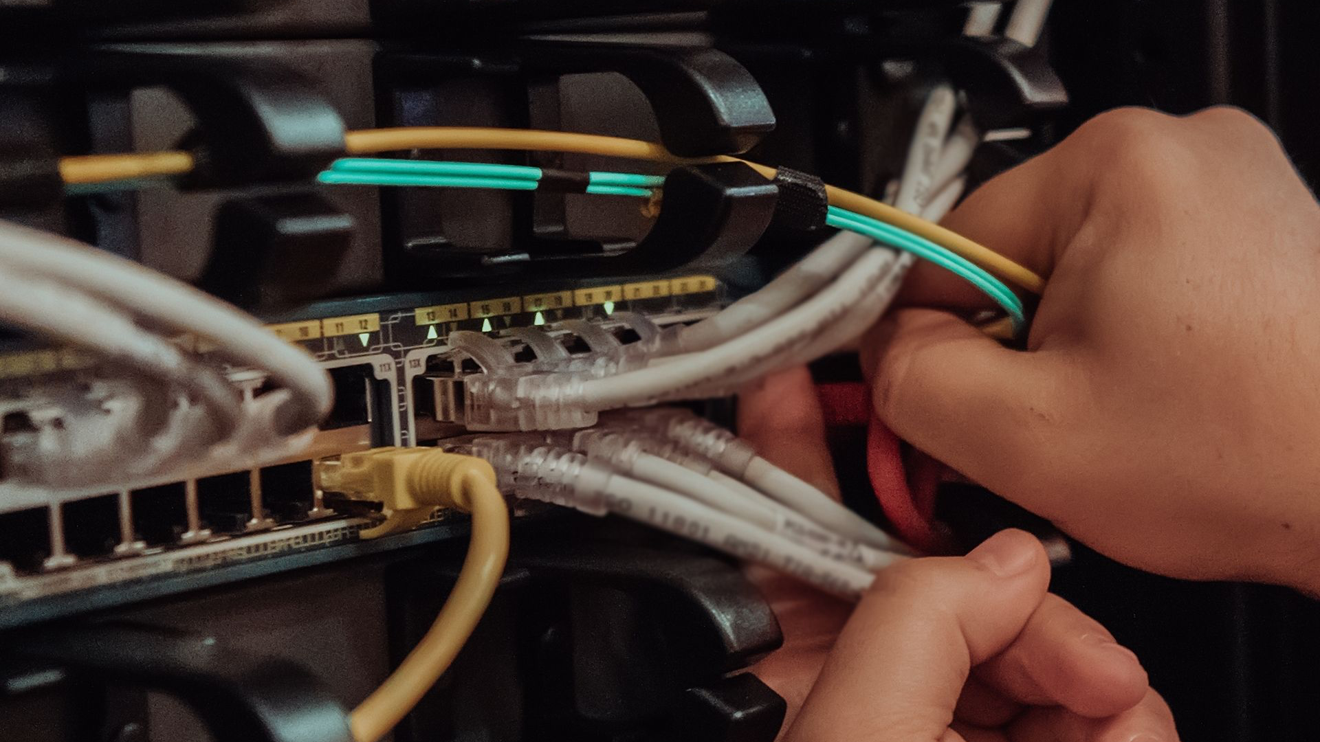 Technician configuring network in the server room